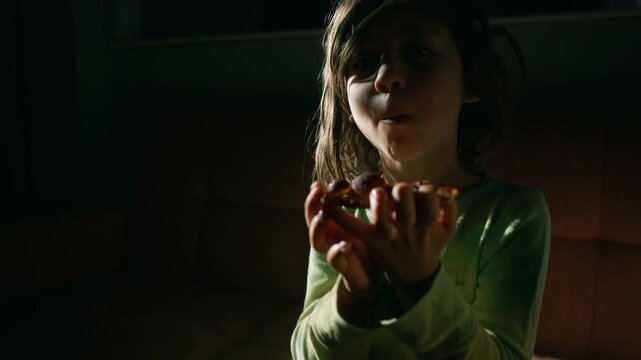 Boy opening a pizza box on movie night