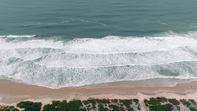 High drone view of surf lines at Ingleses Beach shoreline