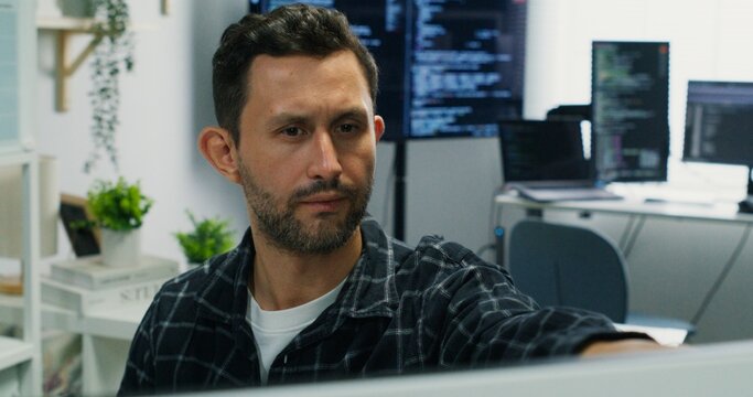 Cybersecurity engineer monitoring encryption. Caucasian man typing code, ensuring secure network and communication in a modern office workplace.
Engineer Analyzing Digital Security System.