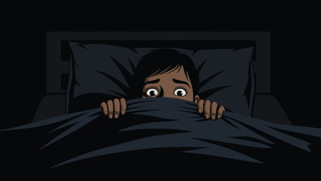 Young boy hiding under a dark blanket in bed with wide eyes looking scared of the dark and nightmares in a spooky atmosphere.