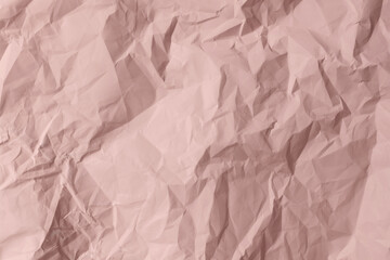 Fototapeta premium Pink crumpled paper texture background. Wrinkled rose pastel sheet surface for romantic Valentine or aesthetic retro design