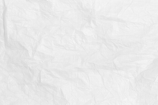 White crumpled tissue paper texture background. Thin wrinkled tracing sheet surface for delicate packaging wrapping overlay