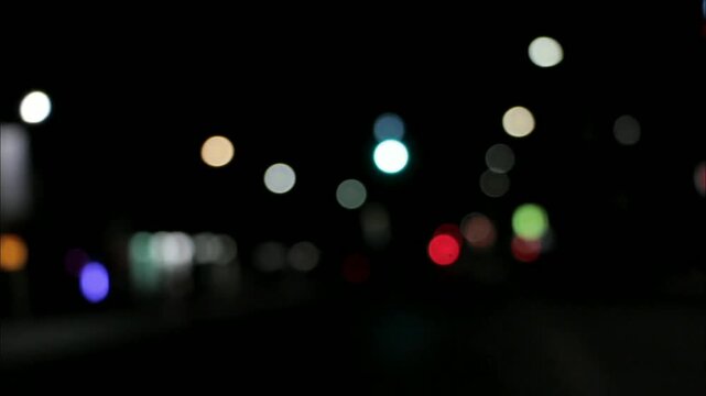 A paused video displays the prompt "DOUBLE TAP TO ADD TEXT" in white, centered on a dark screen with blurred, out-of-focus city lights in the background.
