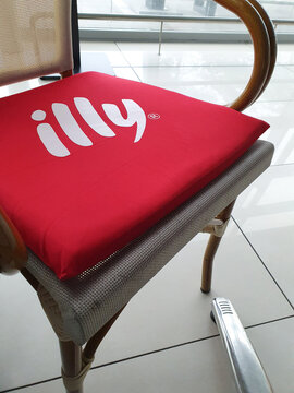 Illy sign on bar chair