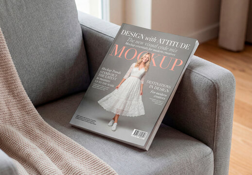 Blank magazine mockup on sofa in cozy living room