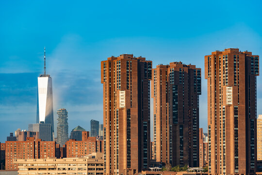 An urban landscape in New York features a variety of architectural styles ranging from classic brick to contemporary glass and steel.