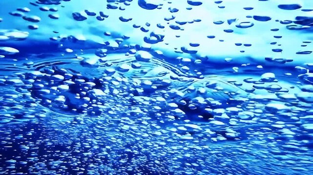 Large Air Bubble Rising in Deep Blue Ocean Water with Trail of Tiny Bubbles, Underwater Macro Shot of Oxygen Release in Sea