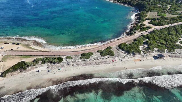 Forward Drone Flight Over Capo Testa Coastal Path with Divided Sea in Sardegna
