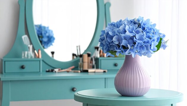 Elegant blue hydrangea bouquet in vase on vintage vanity table