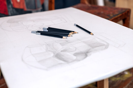 A drawing of a human skull done in pencil on white paper. Student work by an artist and designer. 