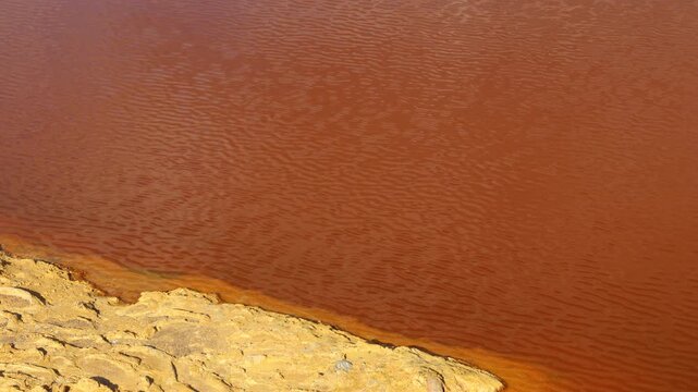 Toxic red acid mine drainage at Lousal Mine in Portugal