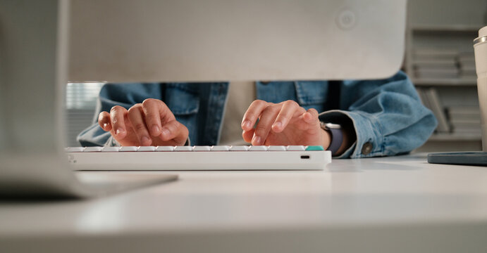 Person's hands typing keyboard for work from home