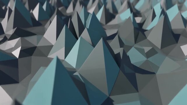 Blue and gray geometric pyramid shapes move in a slow rhythmic wave pattern across this seamless three dimensional digital motion background video clip