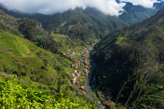 Mountain valley parish in Madeira with road, river, and houses