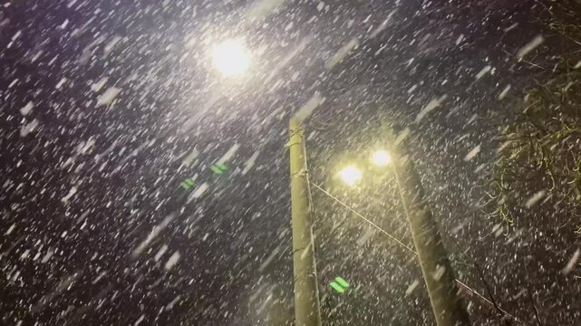 A snowstorm and snowfall on the evening streets of the city. The city is buried in snow. Ternopil, Ukraine, 