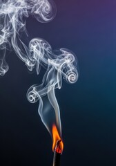 Fototapeta premium Close up macro shot showing a small flame being extinguished by a powerful gust of wind, resulting in smoke rising quickly, power, fast, strong