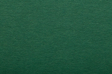 Fototapeta premium Dark green paper texture background. Rough blank canvas sheet surface for elegant luxury graphic design or Christmas card