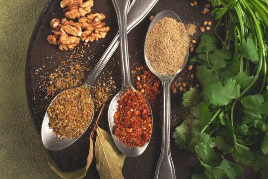 Georgian spices in spoons, on ketsi, top view, no people,