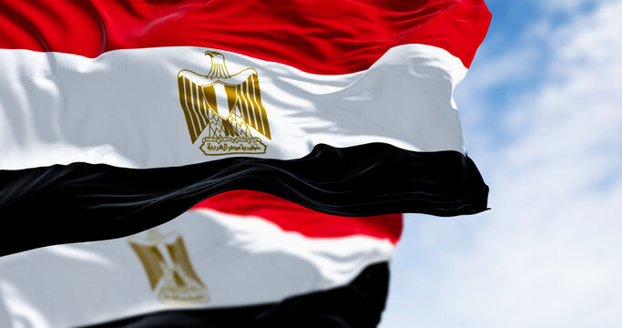 National flags of Egypt waving in the wind on a clear day