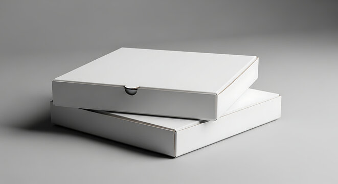 Stack of two blank white cardboard pizza boxes on a grey background, ready for mockup design