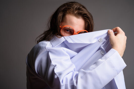 Mysterious Mad Scientist Hiding Behind Lab Coat - Secretive Man in Orange Glasses