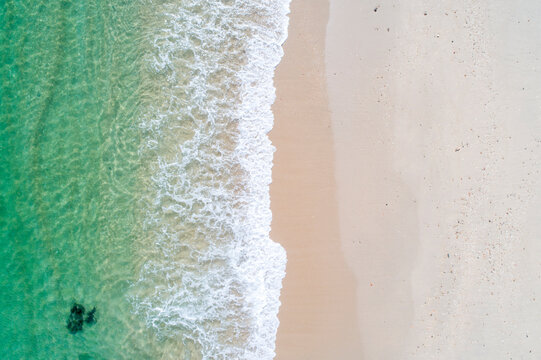 Waves washing the shore of a tropical beach The Concept of Vacation