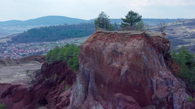 Aerial orbit of Racoș volcanic crater cliff