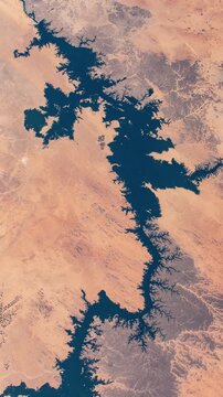 Vertical flying over Lake Nasser Egypt desert reservoir satellite view from space based on Nasa imagery