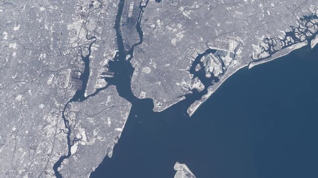 Flying over New York Manhattan winter snow cityscape satellite view from space based on Nasa imagery