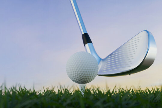 Close-up of a golf iron club about to hit a white ball on a tee. Professional sports equipment on green grass against a clear sunset sky. golf tournament advertising.