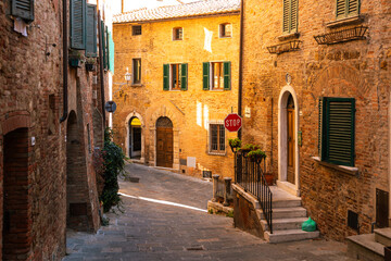 Obraz premium Charming Montepulciano alley winding through old Tuscan town, Italy.