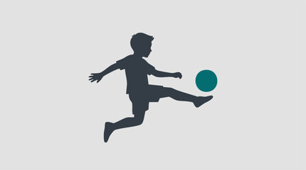 Minimalist silhouette of a young boy kicking a soccer ball. © Tahphoto