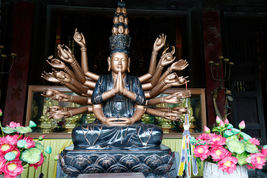 Phuc Lam Du Pagoda.  Magnificent multi-armed Avalokitesvara bodhisattva with stacked faces. Haiphong. Vietnam.