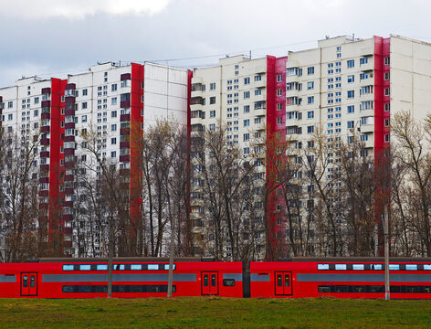 Red train carriages near red secondhand realty transportation architecture