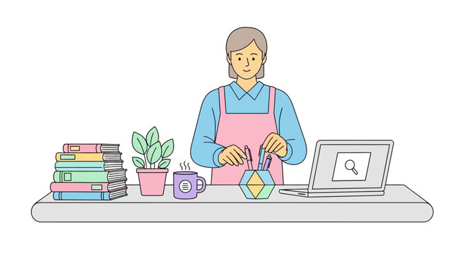 Woman working at home desk with laptop.