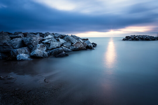 Moody sky over a coastal landscape at sunrise, USA