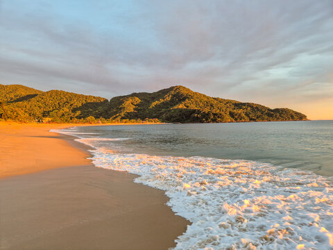 Incredible orange sunset on a paradisiacal beach.