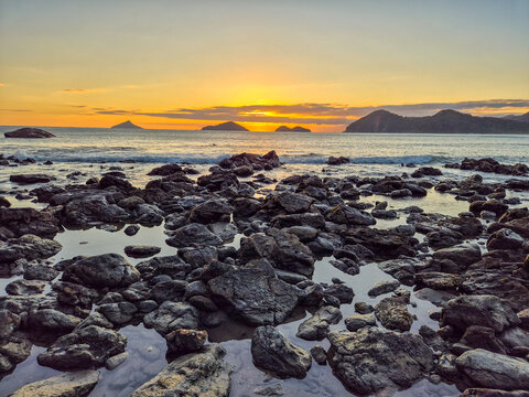 Incredible orange sunset on a paradisiacal beach.