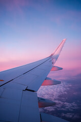 Airplane wing during sunset above clouds © 108pictures