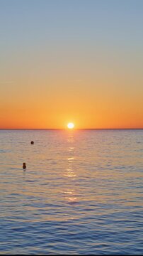 mesmerizing sea with soft waves at sunrise vertical