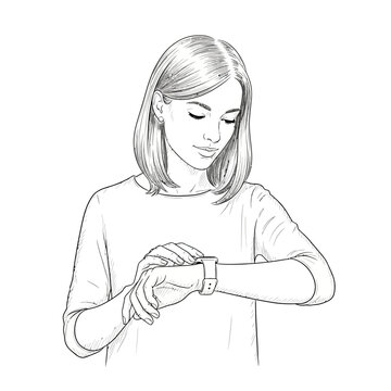 Young woman checking smart watch on her wrist, looking down with a smile