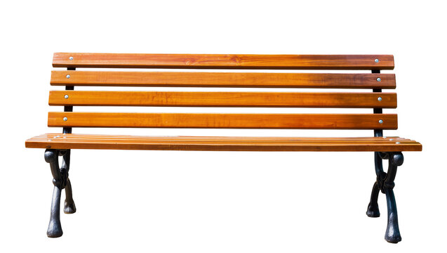 Isolated empty classic wooden park bench with ornate black metal legs for outdoor relaxation