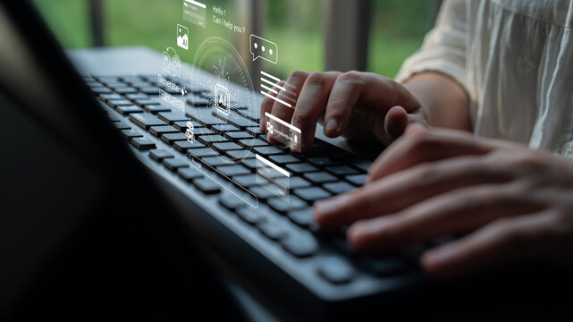 A close-up view of hands typing on a keyboard, with digital interface graphics above, illustrating technology, data flow, and communication in a modern workspace. Ledger