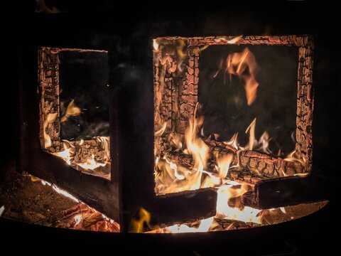 A fireplace with flames and embers in Hamburg, Germany.