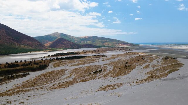 Scenic Aerial Panorama Drone Video of the Bucao River and mountain range and Mount Katung-uhan, with Volcanic Ash in Botolan, Zambales in the Philippines