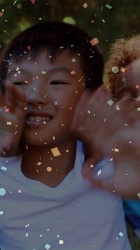 Vertical video: Confetti starting two boys reaching lens waving leaning for education content