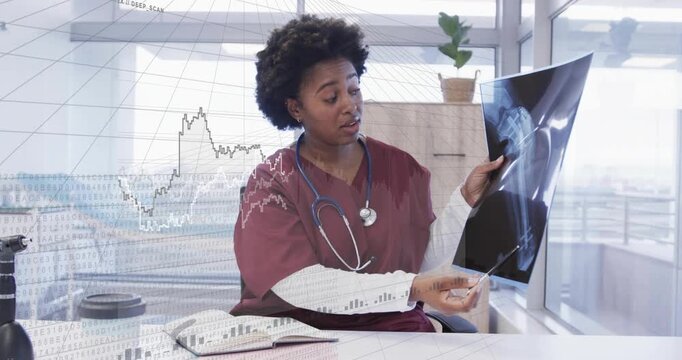 Vertical video: Showing nurse in maroon scrubs pointing at Xray by window with pen graphs appearing