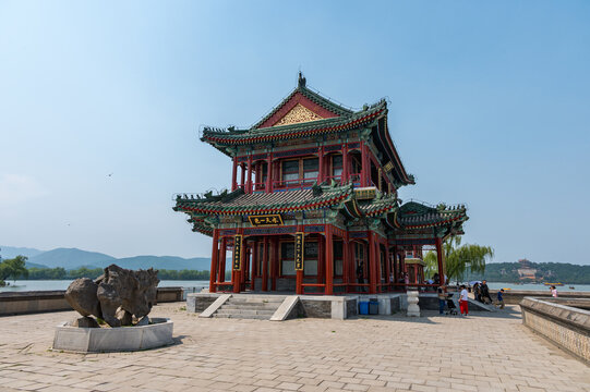 Visitors walk past a beautiful traditional Chinese pavilion overlooking Kunming Lake at the Summer Palace in Beijing, China 27 May 2025