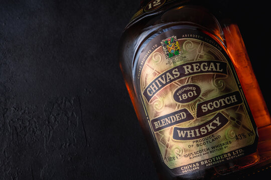 Chivas Regal whisky old bottle on dark	