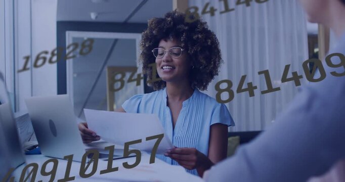 Woman reading docs lifting sheet checking laptop explaining finance as moving numbers marking pages